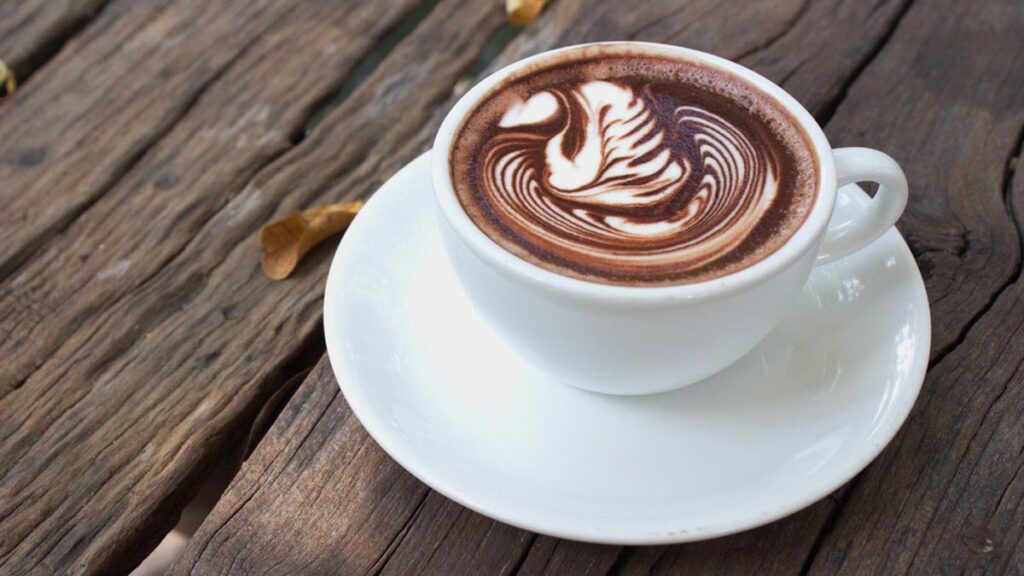 A cup of coffee on a table representing mushroom coffee and diabetes